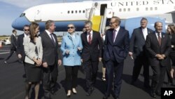 U.S. Secretary of State Hillary Rodham Clinton, third from left, meets with from left, Lyn Barnett, her husband Western Australia Premier Colin Barnett, Australian Defense Minister Stephen Smith, Australian Foreign Minister Bob Carr, Australian Ambassador