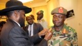 South Sudan's President Salva Kiir decorates newly appointed army chief General James Ajongo during his swearing-in ceremony at the Presidential Palace in Juba, South Sudan, May 10, 2017.