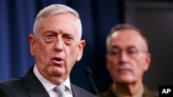 Defense Secretary Jim Mattis, joined by Joint Chiefs Chairman Gen. Joseph Dunford, speaks at the Pentagon, April 13, 2018.