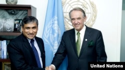 FILE - Then-Deputy Secretary-General Jan Eliasson, right, meets with Tapan Mishra, incoming United Nations Resident Coordinator and United Nations Development Program Resident Representative for the Democratic People's Republic of Korea, June 5, 2015.