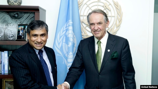 FILE - Then-Deputy Secretary-General Jan Eliasson, right, meets with Tapan Mishra, incoming United Nations Resident Coordinator and United Nations Development Program Resident Representative for the Democratic People's Republic of Korea, June 5, 2015.