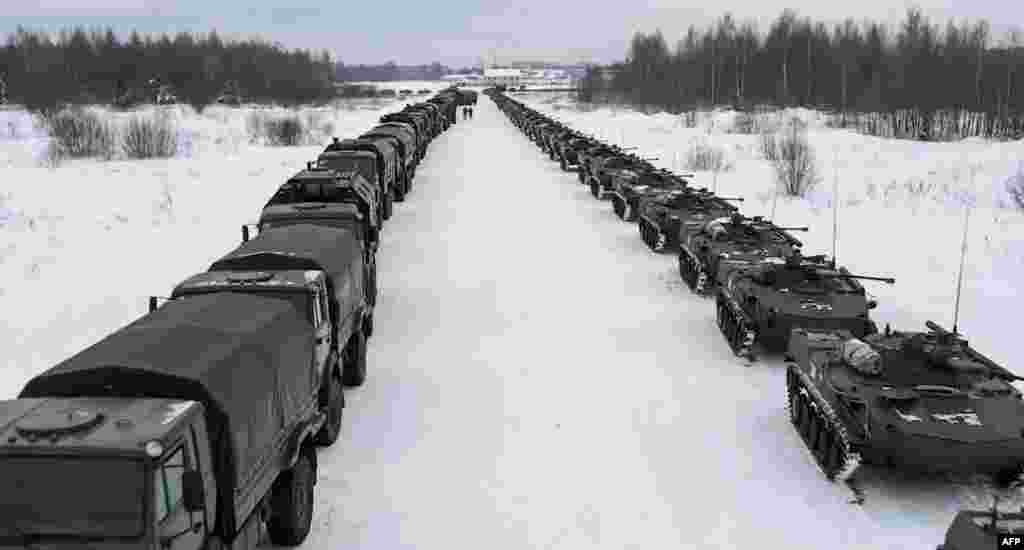 Lines of Russian military vehicles wait for loading to a military cargo plane to depart to Kazakhstan at the airport of Ivanovo, in this handout image grab taken on Jan. 6, 2022, and released on Jan. 7, 2022, by the Russian Defence Ministry.