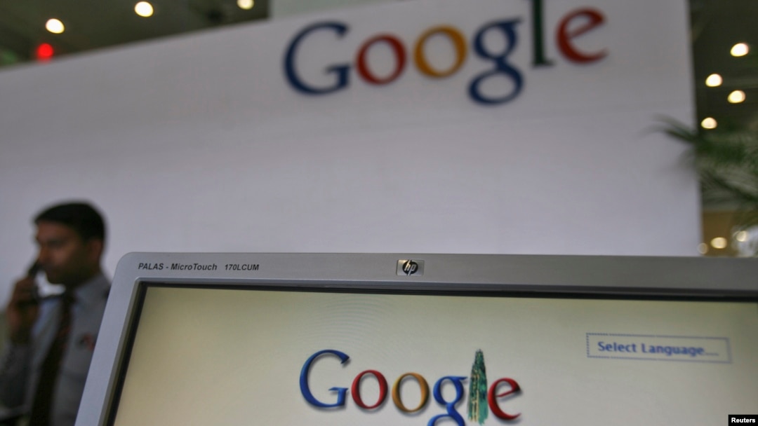 FILE - Security personnel answer a call at the reception counter of the Google office in the southern Indian city of Hyderabad.