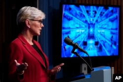 Secretary of Energy Jennifer Granholm announces a major scientific breakthrough in fusion research that was made at the Lawrence Livermore National Laboratory in California, during a news conference at the Department of Energy in Washington, Tuesday, Dec. 13, 2022. (AP Photo/J. Scott Applewhite)