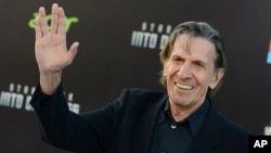 FILE - Leonard Nimoy arrives at the Los Angeles premiere of "Star Trek Into Darkness" at the Dolby Theater, May 14, 2013.