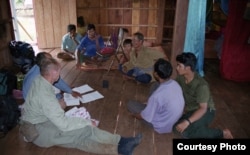 Dr. Sylvain Vogel is talking to Bunong people in Mondulkiri. (Courtesy photo provided by Peter Maguire)