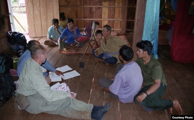 Dr. Sylvain Vogel is talking to Bunong people in Mondulkiri. (Courtesy photo provided by Peter Maquire)