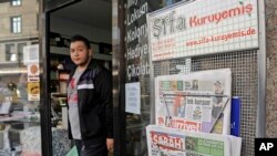 FILE - Turkish newspapers are sold in front of a shop at the Turkish neighborhood in Duisburg-Marxloh, Germany, Monday, Oct. 31, 2011. 