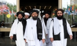 Members of a Taliban delegation leaving after peace talks with Afghan senior politicians in Moscow, Russia May 30, 2019.