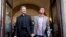 Monsignor Krzysztof Charamsa (l), and his boyfriend Eduard, surname not given, pose for a photo as they leave a restaurant after a news conference in downtown Rome, October 3, 2015.