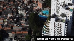 An aerial view shows the city's biggest slum Paraisopolis next to luxury apartment buildings in Sao Paulo, Brazil April 2, 2020.