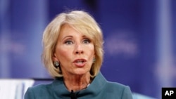 In this file photos, Education Secretary Betsy DeVos speaks during the Conservative Political Action Conference (CPAC), at National Harbor, Maryland, Feb. 22, 2018.