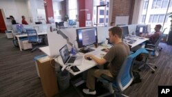 FILE: Workers at the Target Technology Innovation Center office in San Francisco. Taken Sept. 19, 2013