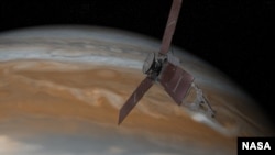 This artist's rendering shows NASA's Juno spacecraft passing over Jupiter. Powered by solar energy, it is about 28 by 15 meters.