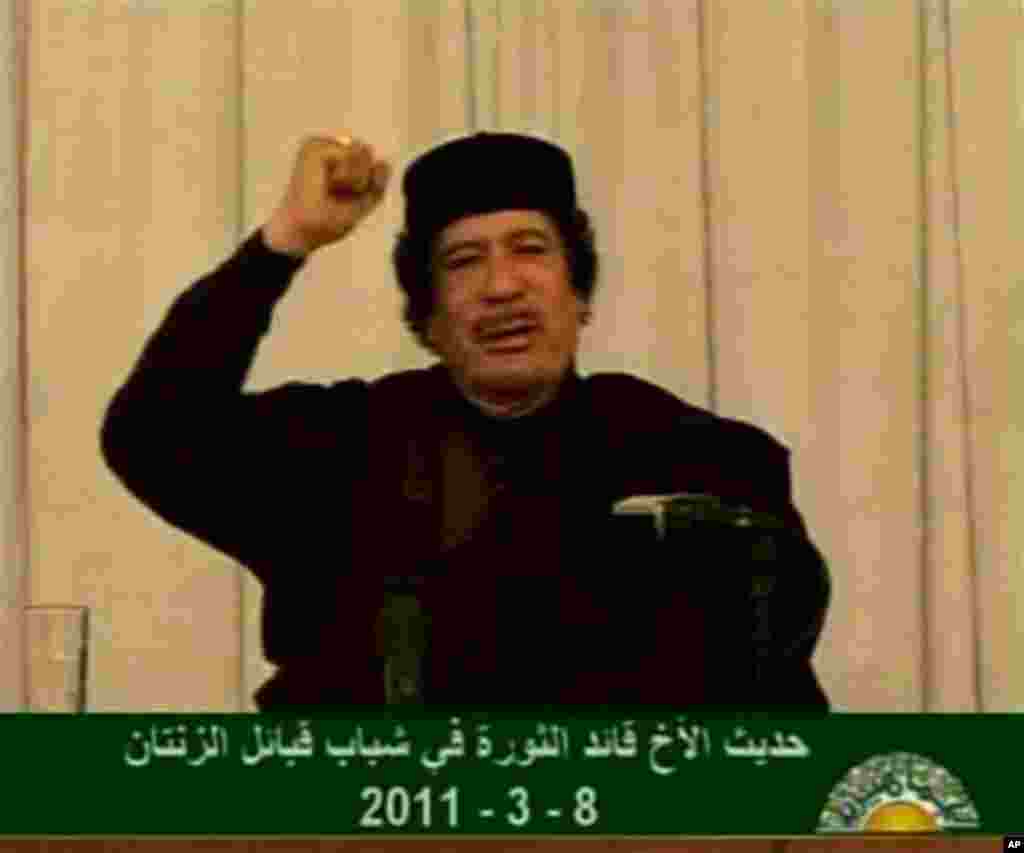 Video image taken from Libyan state television broadcast shows Libyan leader Moammar Gadhafi addressing supporters, March 9, 2011