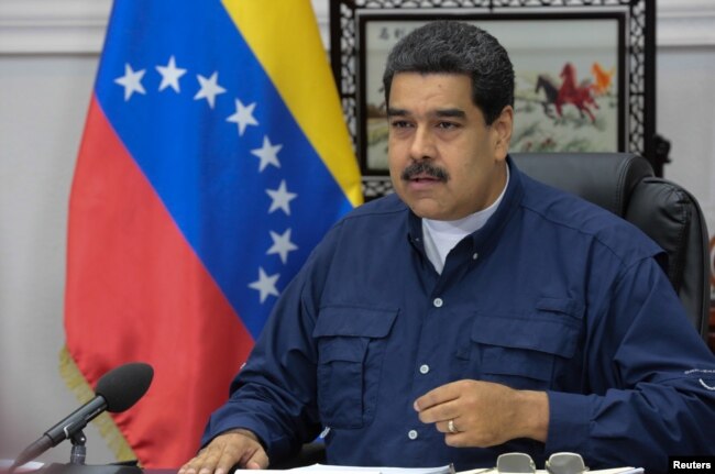 FILE - Venezuela's President Nicolas Maduro speaks during a Council of Ministers meeting at Miraflores Palace in Caracas, Venezuela, May 16, 2017.