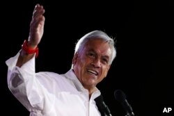 FILE - Sebastian Pinera addresses supporters at his closing campaign rally in Santiago, Chile, Nov. 16, 2017.