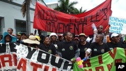 Demonstrators march outside the U.N. climate conference in Durban, South Africa, December 3, 2011.