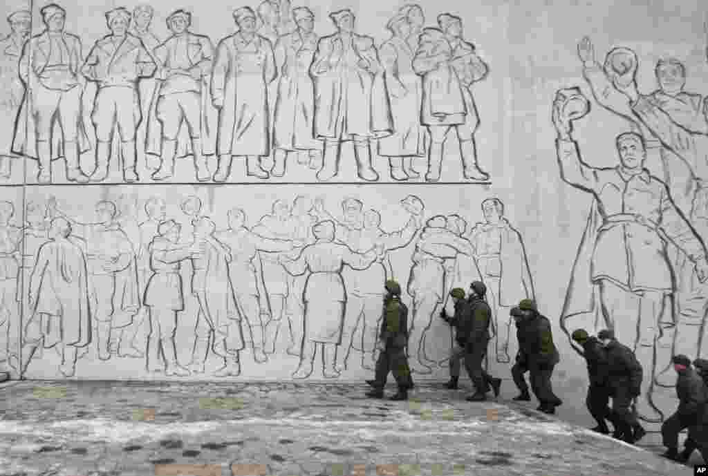 Russian soldiers patrol the Battle of Stalingrad memorial in Volgograd, Russia.