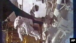 This image taken from video by NASA television shows astronaut Stephen Bowen during a spacewalk, February 28, 2011