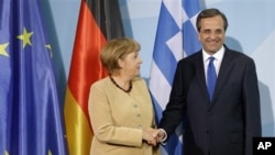 Almanya Başbakanı Angela Merkel ve Yunanistan Başbakanı Antonis Samaras