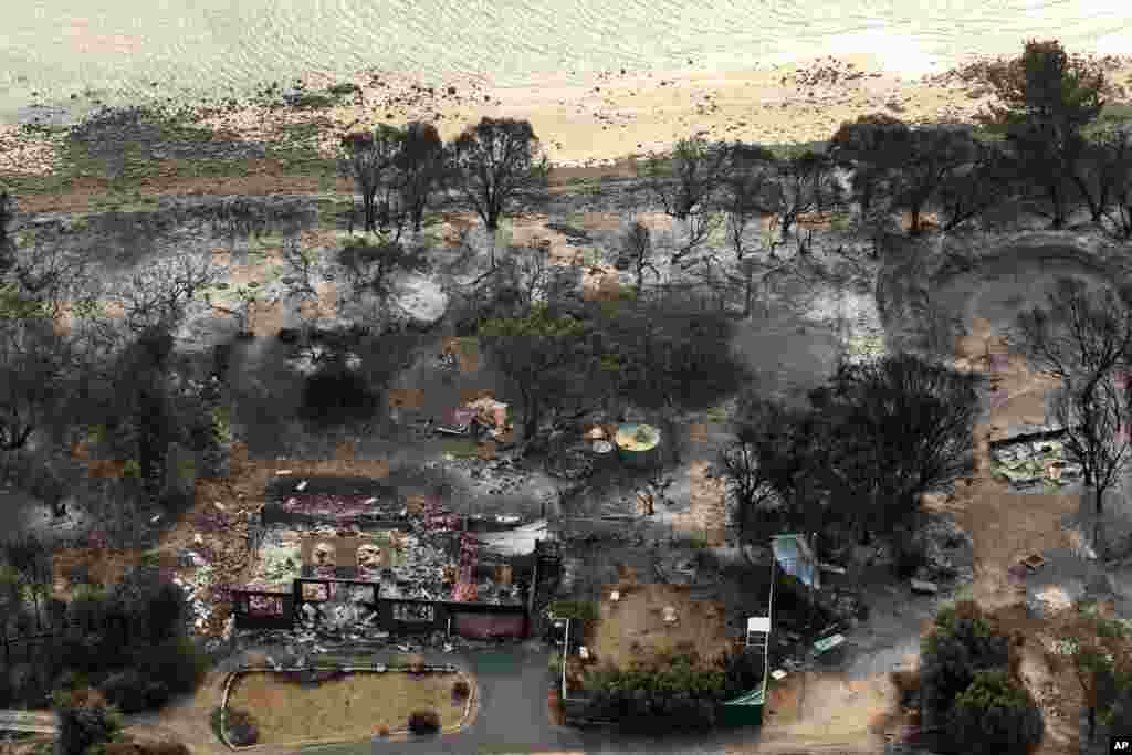 This aerial photo shows homes destroyed by a wildfire near Boomer Bay, in southern Australia, January 5, 2013. 