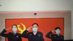 中国公安部副部长孙力军与火线入党的武汉抗疫一线女警察 （推特截图）