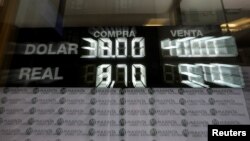 An electronic board shows currency exchange rates, in Buenos Aires' financial district in Argentina, Sept. 4, 2018.