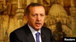 FILE - Turkey's Prime Minister Tayyip Erdogan speaks during a press conference. 