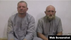 Григорий Цуркану (слева) и Роман Заболотний в плену у ИГИЛ