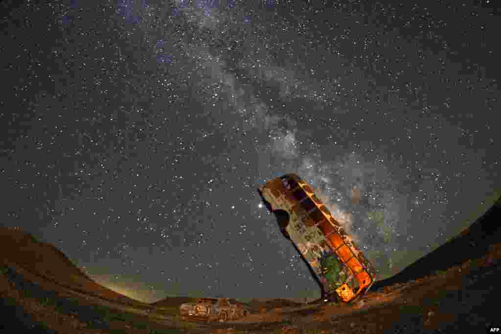 The Milky Way galaxy is seen in the sky above the International Car Forest of the Last Church in Goldfield, Nevada, July 18, 2020.