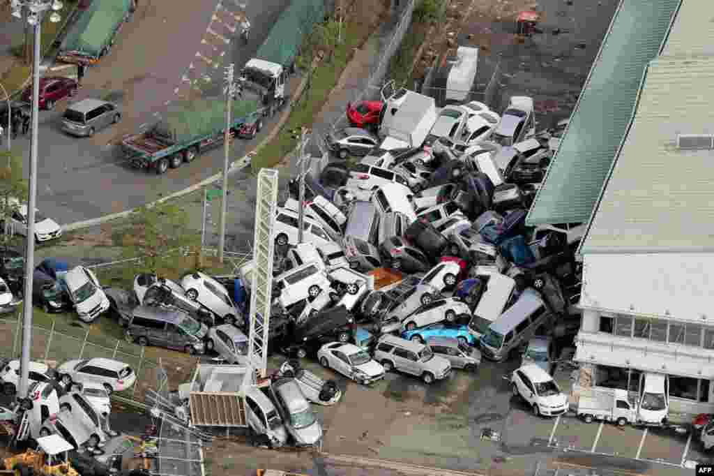 An aerial view from a Jiji Press helicopter shows vehicles piled in a heap due to strong winds in Kobe, Hyogo prefecture, after typhoon Jebi hit the west coast of Japan. The death toll in the most powerful typhoon to hit Japan in a quarter century rose to nine, with thousands stranded at a major airport because of storm damage.