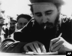 Fidel Castro is pictured at the front during the Bay of Pigs invasion in this 1961 photo.