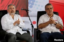 FILE - Venezuela's then-Oil Minister Nelson Martinez, left, and Eulogio del Pino, president of Venezuelan state oil company PDVSA, are seen at a swearing-in ceremony of the new board of directors of PDVSA in Caracas, Venezuela, Jan. 31, 2017.