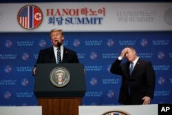 FILE - President Donald Trump speaks as Secretary of State Mike Pompeo looks on during a news conference after a summit with North Korean leader Kim Jong Un in Hanoi, Feb. 28, 2019.
