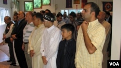 American Muslims are seen offering Eid al-Fitr prayers at a community center in northern Virginia August 8, 2013 (Mohamed Elshinnawi/VOA).