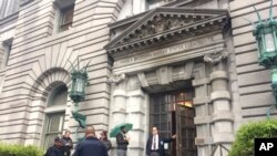 Security officers are seen outside the 9th U.S. Circuit Court of Appeals building in San Francisco, Feb. 9, 2017. 