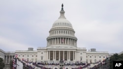 FILE - Insurrections loyal to President Donald Trump rally at the U.S. Capitol in Washington on Jan. 6, 2021.