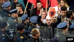 Kosovo Albanians waving Albanian national flags take part in a demonstration in Pristina, Nov. 3, 2017, to protest against the verdict of the Macedonian court that sentenced an eighth ethnic Albanian man to life in prison over a 2015 shootout with police 