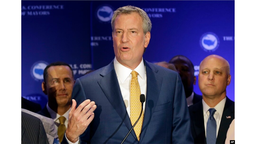 New York City Mayor Bill de Blasio talks to reporters during a news conference at the U.S. Mayors Conference, June 23, 2017, in Miami Beach, Florida.