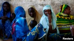 Internally displaced women from Bangui attend a community meeting in Bambari, Central African Republic, June 16, 2014.