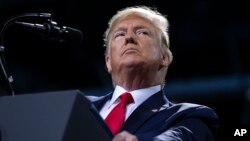 FILE - President Donald Trump speaks during a campaign rally at Kellogg Arena, in Battle Creek, Mich., Dec. 18, 2019.