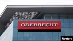 FILE - A sign on the offices of the Odebrecht construction conglomerate in Lima, Peru, June 28, 2016.