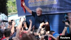 FILE - Former Brazilian President Luiz Inacio Lula da Silva is carried by supporters in front of the metallurgic trade union in Sao Bernardo do Campo, Brazil, April 7, 2018. 