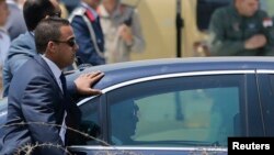 FILE - Members of the presidential guard surround the motorcade of Egypt's President Abdel Fattah al-Sissi in Cairo June 8, 2014.