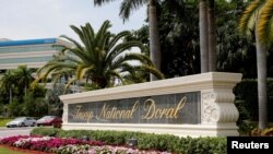 FILE - This marker is at the entrance to the Trump National Doral golf resort in Doral, Fla. 
