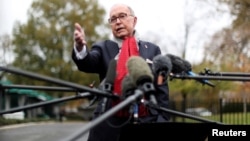 White House chief economic adviser Larry Kudlow speaks to reporters outside the White House in Washington, Nov. 13, 2018. 