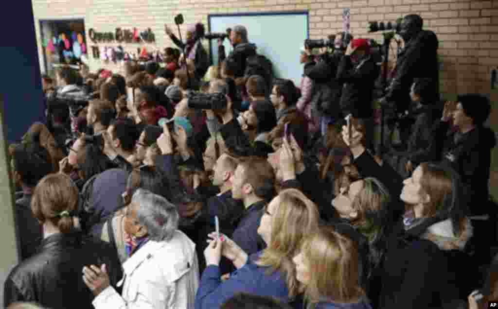 Well wishers gather and take photos as Britain's Prince William leaves St. Mary's Hospital's exclusive Lindo Wing, London, Saturday, May 2, 2015. William's wife, Kate, the Duchess of Cambridge, gave birth to a baby girl on Saturday morning. (AP Photo/Mat