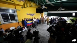 Venezuelan community leaders speak during a press conference to denounce changes to the protections that shielded hundreds of thousands of Venezuelans from deportation, Feb. 3, 2025, in Doral, Florida.