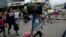 FILE - Venezuelans leave their country as they make their way to the Simon Bolivar international bridge in San Antonio del Tachira, Venezuela, on the border with Colombia, Feb. 21, 2019. 